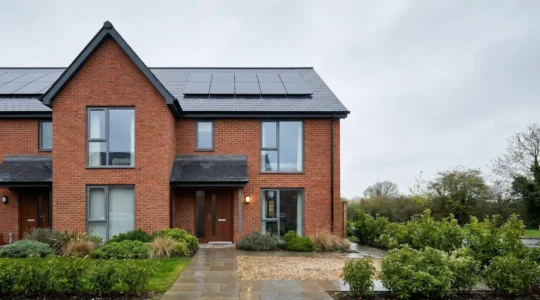 Modern UK residential property showcasing energy efficiency features with professional editorial composition